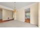 Spacious dining room with chandelier, neutral carpet, and easy access to the kitchen at 3270 Golfe Links Dr, Snellville, GA 30039