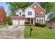 Beautiful two-story brick home with attached two-car garage and well-manicured lawn at 3270 Golfe Links Dr, Snellville, GA 30039