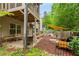 Outdoor space featuring a patio, fire pit area with chairs, and a partial view of the house's exterior at 4876 Briarcliff Dr, Sugar Hill, GA 30518