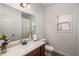 Clean bathroom with modern fixtures, vanity, and a neutral color scheme at 4876 Briarcliff Dr, Sugar Hill, GA 30518