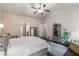 Cozy bedroom showcasing a light-filled space with a comfortable rug and sitting area at 4876 Briarcliff Dr, Sugar Hill, GA 30518