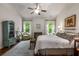 Bright bedroom with a ceiling fan, natural light, and a comfortable, inviting design at 4876 Briarcliff Dr, Sugar Hill, GA 30518