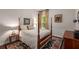 Inviting bedroom featuring a four-poster bed, warm lighting, and rich wooden accents at 4876 Briarcliff Dr, Sugar Hill, GA 30518