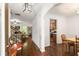 Elegant foyer with hardwood floors, detailed trim, and views of the living room and dining area at 4876 Briarcliff Dr, Sugar Hill, GA 30518