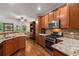 Well-equipped kitchen with stainless steel appliances, granite countertops, and ample cabinet space at 4876 Briarcliff Dr, Sugar Hill, GA 30518