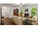 Comfortable living room featuring a fireplace, bright windows, and hardwood floors at 4876 Briarcliff Dr, Sugar Hill, GA 30518