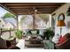 Comfortable screened-in porch featuring wicker furniture and greenery at 1021 Bluffhaven Ne Way, Atlanta, GA 30319