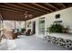 Spacious, screened-in back porch with brick accents and outdoor seating at 1021 Bluffhaven Ne Way, Atlanta, GA 30319