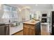 Bright kitchen boasts stainless steel appliances, a farmhouse sink, and a rustic island at 1021 Bluffhaven Ne Way, Atlanta, GA 30319