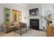 Cozy living room with fireplace, vintage soda posters, and comfortable seating at 1021 Bluffhaven Ne Way, Atlanta, GA 30319
