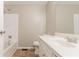 Clean bathroom with a white vanity, toilet, and tiled shower and tub combination at 1051 S Millard Way, Stone Mountain, GA 30088