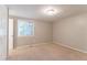 Bedroom featuring neutral paint, a window, a closet, and carpet flooring at 1051 S Millard Way, Stone Mountain, GA 30088