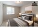 Staged primary bedroom with decor, window, and closet at 1051 S Millard Way, Stone Mountain, GA 30088
