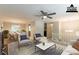 Bright living room with ceiling fan, plush chairs, and a stylish dining area at 1051 S Millard Way, Stone Mountain, GA 30088