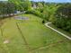 Aerial view of park's sports area, featuring a basketball court, football field, and jogging path at 1911 Rollingwood Se Dr, Atlanta, GA 30316