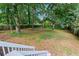 Spacious backyard with mature trees and privacy fence at 1911 Rollingwood Se Dr, Atlanta, GA 30316