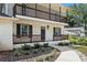 Charming two story home with brick facade, upper and lower porches, and manicured landscaping at 1911 Rollingwood Se Dr, Atlanta, GA 30316