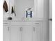 Bathroom featuring white vanity with dual sinks and view through the mirror at 300 Olmstead Way, Alpharetta, GA 30022