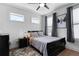 Cozy bedroom with gray accents, hardwood floors, and natural light at 300 Olmstead Way, Alpharetta, GA 30022