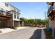 Modern townhome exterior with brick accents, private garages, and professional landscaping at 300 Olmstead Way, Alpharetta, GA 30022