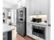 Modern kitchen with stainless steel appliances, microwave, and white cabinets with plenty of counter space at 300 Olmstead Way, Alpharetta, GA 30022