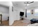 Bright living room with hardwood floors, ceiling fan, and stylish decor at 300 Olmstead Way, Alpharetta, GA 30022