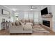 Inviting living room with a fireplace, stylish decor, and comfortable seating at 300 Olmstead Way, Alpharetta, GA 30022