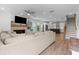 Spacious living room with fireplace, wet bar, and open layout to the kitchen at 300 Olmstead Way, Alpharetta, GA 30022