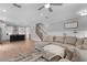 Open-concept living room with a view into the modern kitchen and staircase at 300 Olmstead Way, Alpharetta, GA 30022