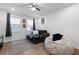 Comfortable living room with cozy seating and natural light from nearby windows at 300 Olmstead Way, Alpharetta, GA 30022