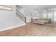 Living room features hardwood floors, natural light, and elegant staircase nearby at 300 Olmstead Way, Alpharetta, GA 30022
