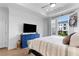 Bright main bedroom with blue dresser, balcony access, and a comfortable king-sized bed at 300 Olmstead Way, Alpharetta, GA 30022