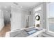 Bright home office with a modern white desk, and a door that opens to the outside patio at 300 Olmstead Way, Alpharetta, GA 30022