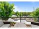 Outdoor patio features comfortable seating and overlooks manicured grounds with lush greenery and walking paths at 300 Olmstead Way, Alpharetta, GA 30022