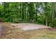 Spacious sand volleyball court surrounded by lush greenery, perfect for outdoor recreation and entertainment at 68 Edwin Pl Nw, Atlanta, GA 30318