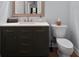 This bathroom features a modern vanity with a dark wood finish and a mirror above at 68 Edwin Pl Nw, Atlanta, GA 30318