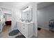 This bathroom features a double vanity, large mirror and tile floors at 68 Edwin Pl Nw, Atlanta, GA 30318