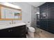 Elegant bathroom featuring sleek vanity, modern fixtures, and a glass-enclosed shower with stylish tile accents at 68 Edwin Pl Nw, Atlanta, GA 30318