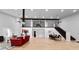 Grand living room with soaring ceilings, natural light, and an elegant staircase at 68 Edwin Pl Nw, Atlanta, GA 30318