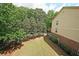 Expansive backyard with lush green lawn, mature trees, and a serene atmosphere at 718 Province Se Pl, Atlanta, GA 30312