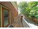 Balcony showing wood decking and white railing in a wooded setting at 718 Province Se Pl, Atlanta, GA 30312