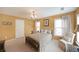 Comfortable bedroom with a queen-size bed, chandelier, and neutral color scheme at 718 Province Se Pl, Atlanta, GA 30312