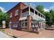 A brick building with 'Grant Park Coffee' signage, a covered porch, and outdoor seating at 718 Province Se Pl, Atlanta, GA 30312
