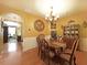 Elegant dining room with beautiful chandelier, seating for six, and a decorative china cabinet at 718 Province Se Pl, Atlanta, GA 30312