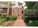 Charming home exterior showcasing brick pathway, attractive landscaping, and stone accents at 718 Province Se Pl, Atlanta, GA 30312