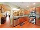 Well-equipped kitchen with modern appliances, wood cabinets, and sleek countertops at 718 Province Se Pl, Atlanta, GA 30312