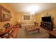 Cozy living room features hardwood floors, ornate mirror, and chandelier at 718 Province Se Pl, Atlanta, GA 30312