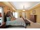 Elegant main bedroom with a large bed, tray ceiling, and decorative accents at 718 Province Se Pl, Atlanta, GA 30312