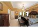 Spacious main bedroom with elegant furnishings, decorative lighting, and a cozy seating area at 718 Province Se Pl, Atlanta, GA 30312