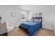 Cozy bedroom with carpet flooring, a queen bed, and natural light coming through the window at 192 Weldon Rd, Mcdonough, GA 30253